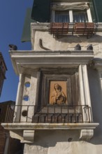 Adoration of Mary at a residential building, Venice, Veneto, Italy