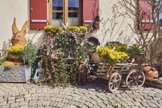 Easter decoration, wooden Easter bunny, historic handcart, flower pots, plant pots, plant pots,