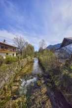Rote Traun river, fortified bank, riverbed, quarry stone wall, rapids with stones, bushes with