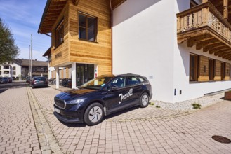 Car with advertising lettering Inzell, town hall, alpine buildings, commercial buildings, building