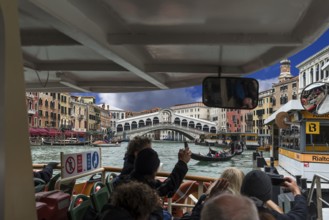 View from a traghetto of the Rialto Bridge, Grand Canal, Venice, Veneto, Italy