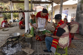 Mising people having traditional food during Ali-Aye-Ligang festival in Guwahati, Assam, India on