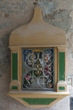 Holy shrine with the figure of Jesus Christ on a house wall, Venice, Veneto, Italy