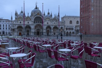 Empty St. Mark's Square with St. Mark's Basilica early in the morning in rainy weather, Venice,