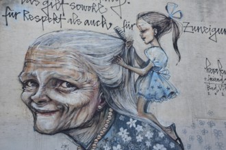 Mural from Herakut 2015, old woman with girl hairdressing her long hair, cosmetics, saying, face,