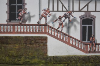 Mural construction by Jaune 2020, alleyway art, graffiti, construction workers jumping on