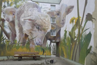 Mural sheep by CASE maClaim 2022, graffiti, street art, sheep figures, dandelion, meadow with