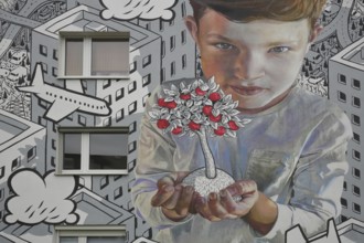Mural by CASE MacAclaim and Millo 2023, street art, boy carrying apple tree in hands, protecting,