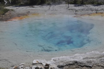 Close-up of a hot spring with clear blue water and steam, Yellowstone National Park, Wyoming, USA