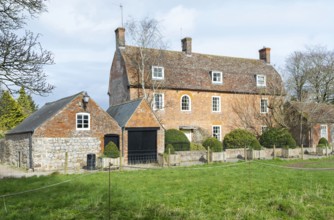 Historic Manor Farm farmhouse building, village of Avebury, Wiltshire, England, UK