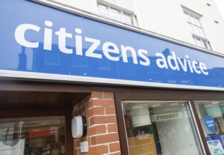 Citizens Advice charity office sign on High Street shopfront, Beccles, Suffolk, England, UK