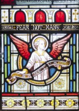 Details of stained glass window of an angel by Clayton and Bell, church of Saint James, Avebury,