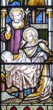 Detail of stained glass window depicting the nativity by Clayton and Bell, church of Saint James,