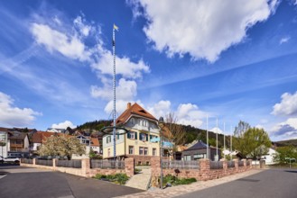 Town hall, maypole, lantern, sandstone wall, wooden fence, street, general development, commercial