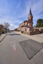 St. Michael church, parish church, neo-Romanesque style, sidewalk, roadway, road marking Attention