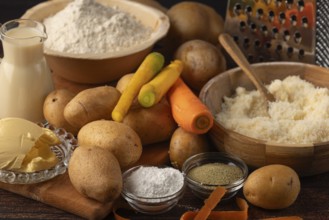 Flour and milk in addition to potatoes, parmesan and carrots