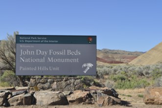John Day Fossil Beds Painted Hills Welcome Sign with Blue Sky and Natural Backdrop, John Day Fossil