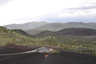Road snakes through volcanic hills, Craters of the Moon National Monument, Idaho, USA