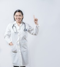Young asian doctor recommending an advertisement. Asian female doctor pointing up isolated