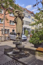 Lauscherbrunnen, stone fountain, sculpture of a person, sculptor Oskar Müller, public art,