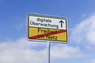 (photo montage) Exit sign with the text FREEDOM ON THE NET and DIGITAL SURVEILLANCE against a blue