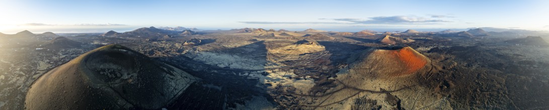 Picturesque volcanic landscape with volcanic craters and lava fields in morning light, Montaña