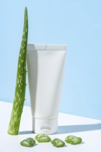 This image portrays a simple and clean representation of beauty and skincare featuring a white tube