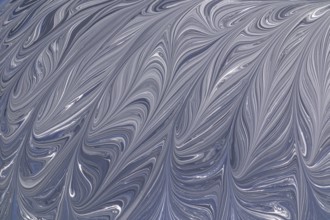 A captivating abstract design in grey and white, featuring elegant swirling patterns. This fluid