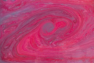 A striking abstract art piece featuring acrylic paint pink and red swirls. This fluid acrylic