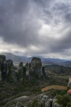 Panoramic view of Meteora's towering rock formations and ancient monasteries in Kalabaka, Greece,