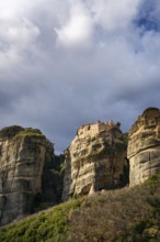 The ancient Varlaam Monastery sits atop towering rock formations at Meteora, Greece. A Unesco World