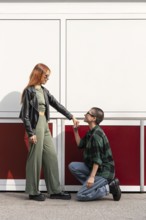 Colombian lesbian couple embraces love and diversity. They represent LGBTQIA+ unity, showcasing