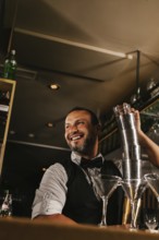 A skilled bartender joyfully mixes cocktails at an elegant bar, showcasing expertise and charm.
