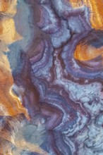 Stunning aerial view of vibrant bentonite formations in Utah, showcasing unique swirling patterns