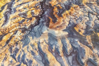 Stunning aerial view of bentonite formations in Utah. The vibrant colors and swirling patterns