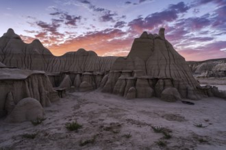 Stunning sunset illuminating the unique rock formations in the Bisti/De-Na-Zin Wilderness in New