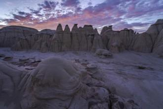 Stunning sunset illuminating the eroded sandstone formations in the Bisti/De-Na-Zin Wilderness,