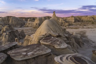 Spectacular sunrise highlighting the unique hoodoo formations in the Bisti/De-Na-Zin Wilderness of