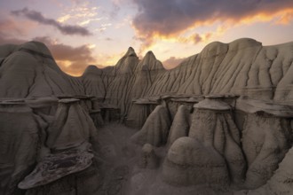 Captivating sunset illuminates the unique sandstone hoodoos in the Bisti/De-Na-Zin Wilderness in