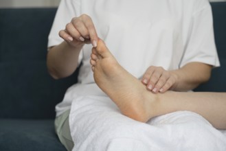 A mother and daughter relax at home, enjoying a self-care day together. They focus on wellness and