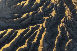Aerial view of Caineville Mesa in Utah, showcasing the stunning textures and patterns of desert