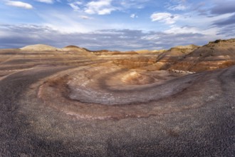Dramatic aerial view of Hanksville Bentonite Hills in Utah, showcasing colorful, layered rock