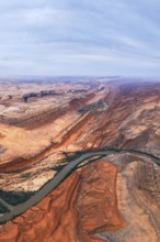 Captivating aerial view of a sprawling San Juan canyon with layered rock formations and a