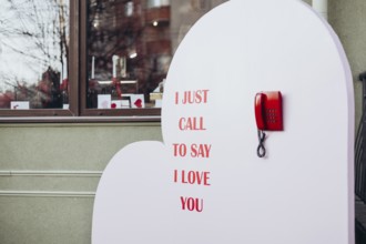 A Valentine's Day display featuring a red phone and the message I just call to say I love you, set