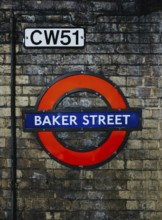 A vibrant image of the Baker Street station sign on London's Underground, set against a textured