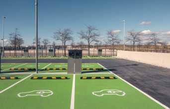 A newly constructed electric vehicle charging station in Valdebebas, Madrid, showcasing green