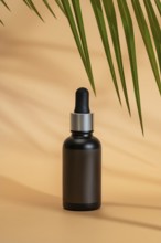 Black cosmetic dropper bottle on a beige background, with palm leaf shadows. The minimalist,