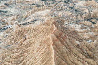A stunning aerial view captures the intricate patterns of an arid mountain landscape Natural