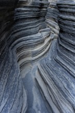 Detailed view of the textured and layered rock formation, showcasing the natural artistry of
