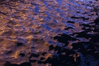 Rippling water creates abstract shapes and textures in this photograph from La Pared, Fuerteventura